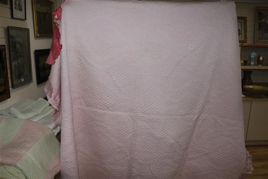 A rose pink and light pink reversible quilt, another reversible with yellow, the other mint green gingham and pink (3)